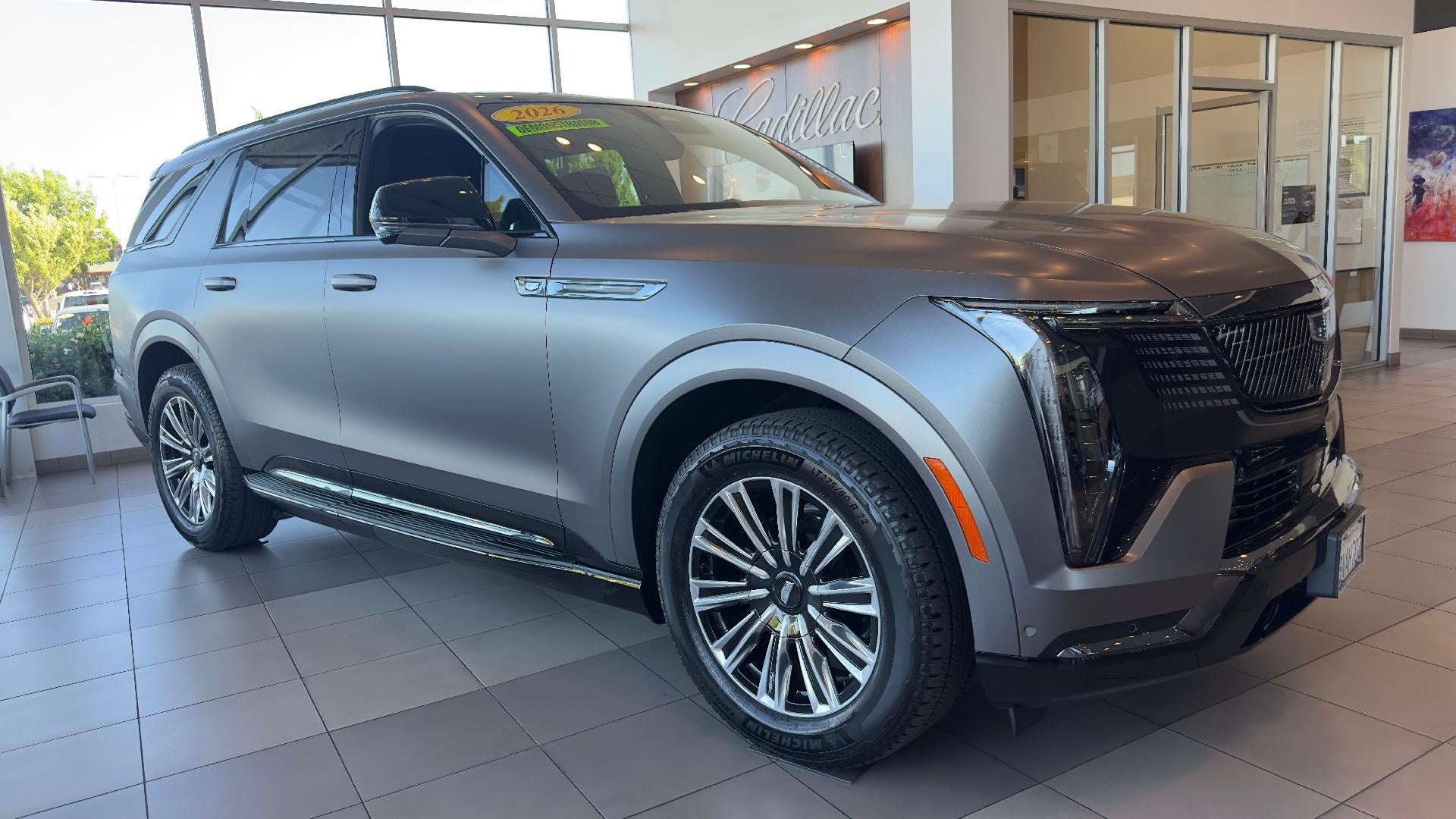 2026 Cadillac ESCALADE IQL Sport in Black Cherry Tintcoat — front three-quarter view
