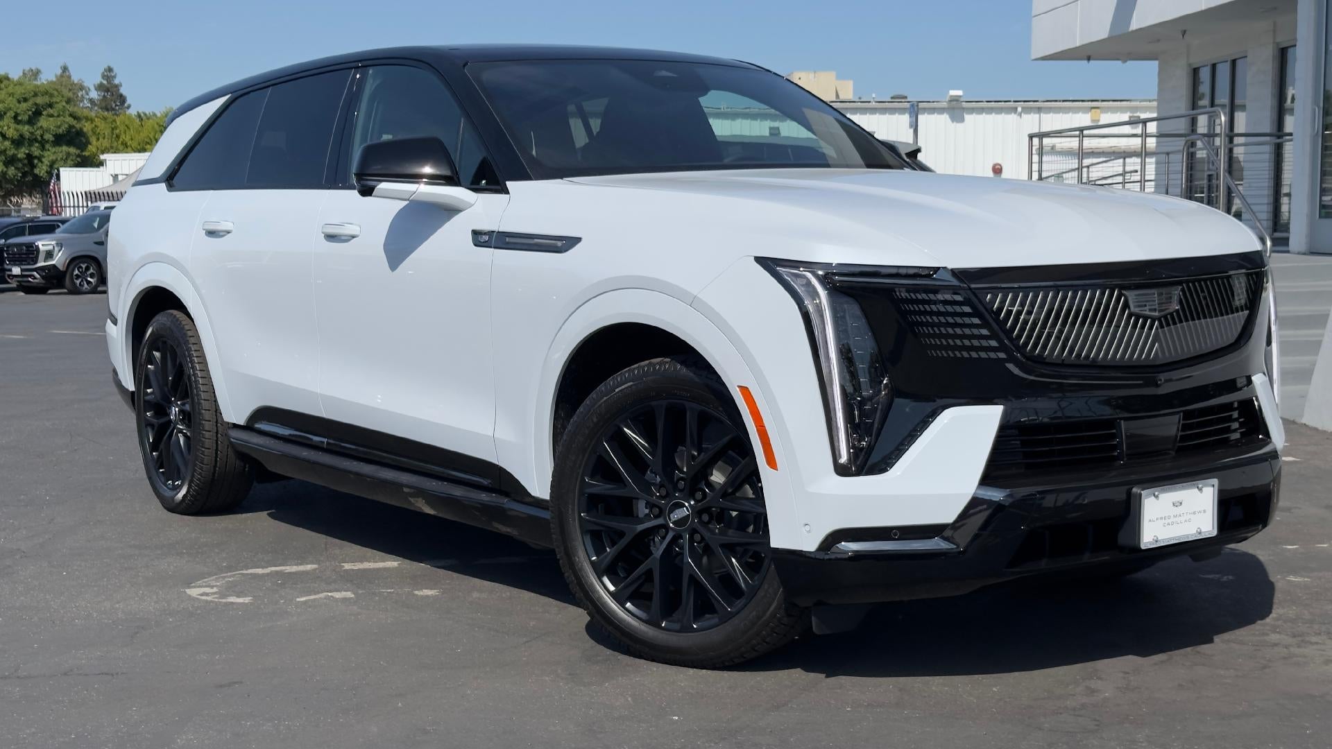 2026 Cadillac ESCALADE IQ Sport in Vibrant White Tricoat — front three-quarter view