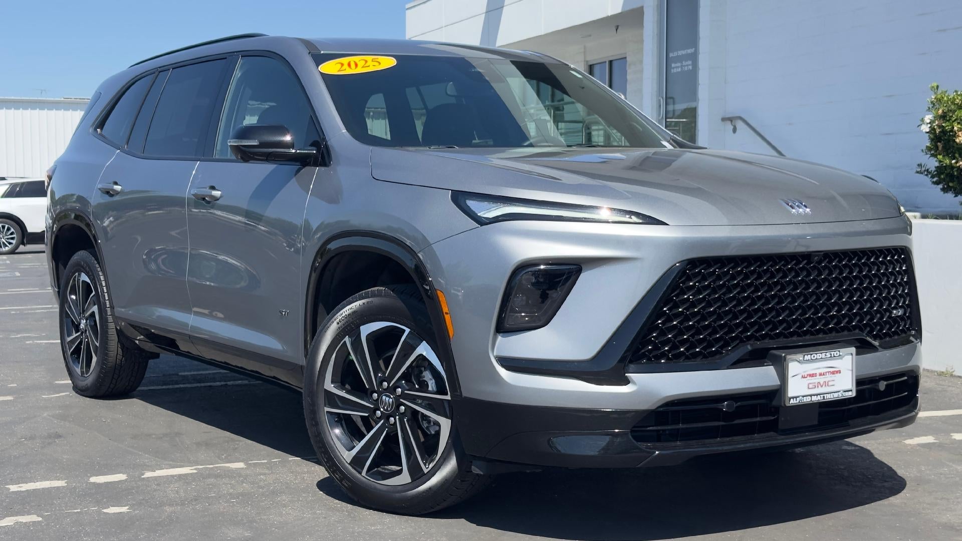 2025 Buick Enclave Sport Touring in Moonstone Gray Metallic — front three-quarter view